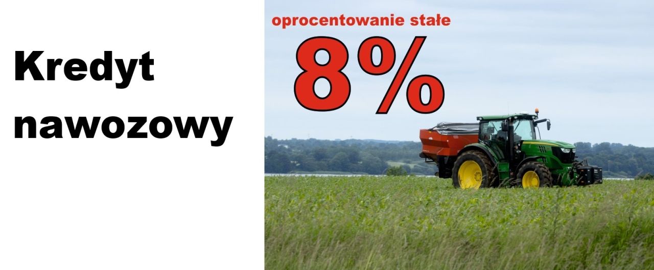 Ciągnik z siewnikiem do nawozu na polu.